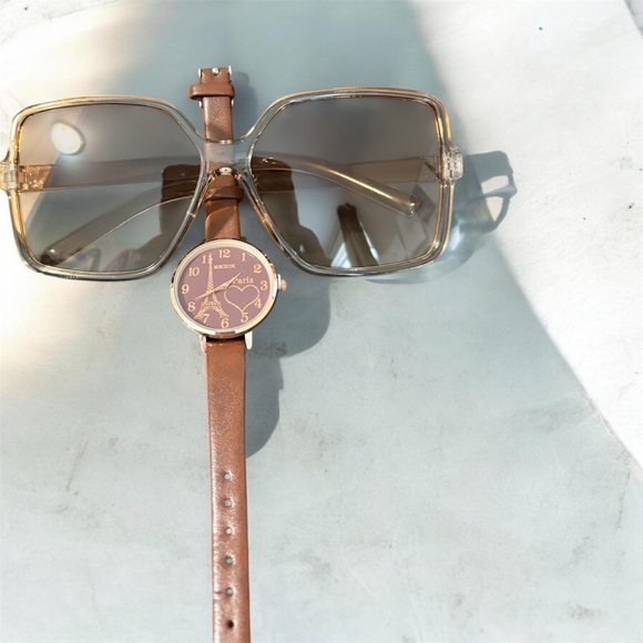 A brown leather strap watch with a heart-shaped dial and sunglasses. main image 2